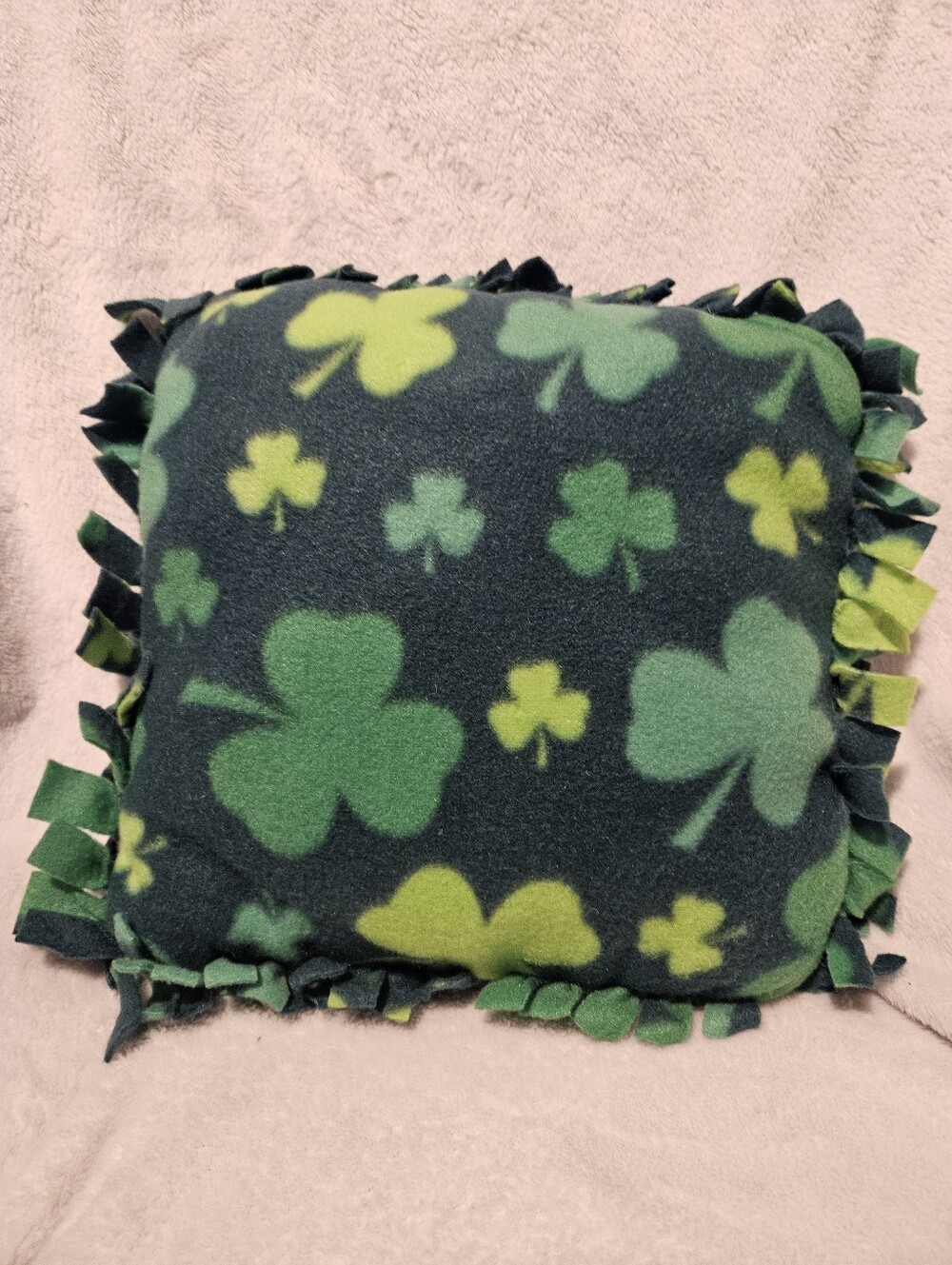Handmade green shamrock fleece accent pillow.  Machine washable,